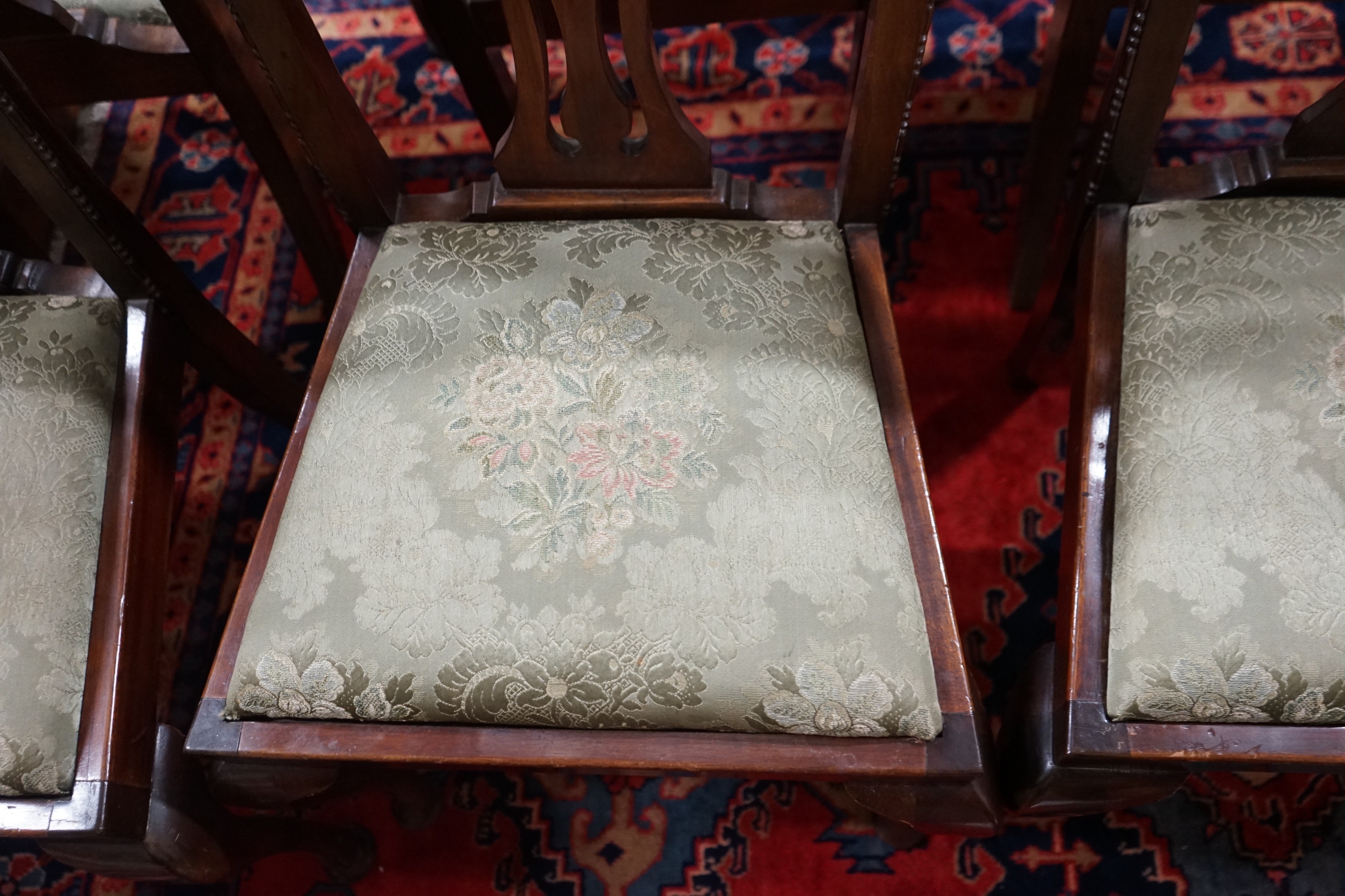 A set of six Chippendale style mahogany dining chairs